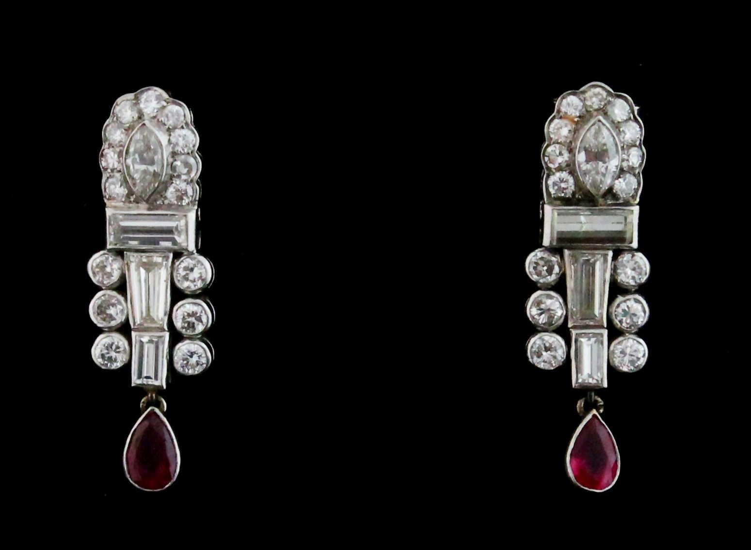 Appraisal: A pair of ruby and diamond drop ear pendants with