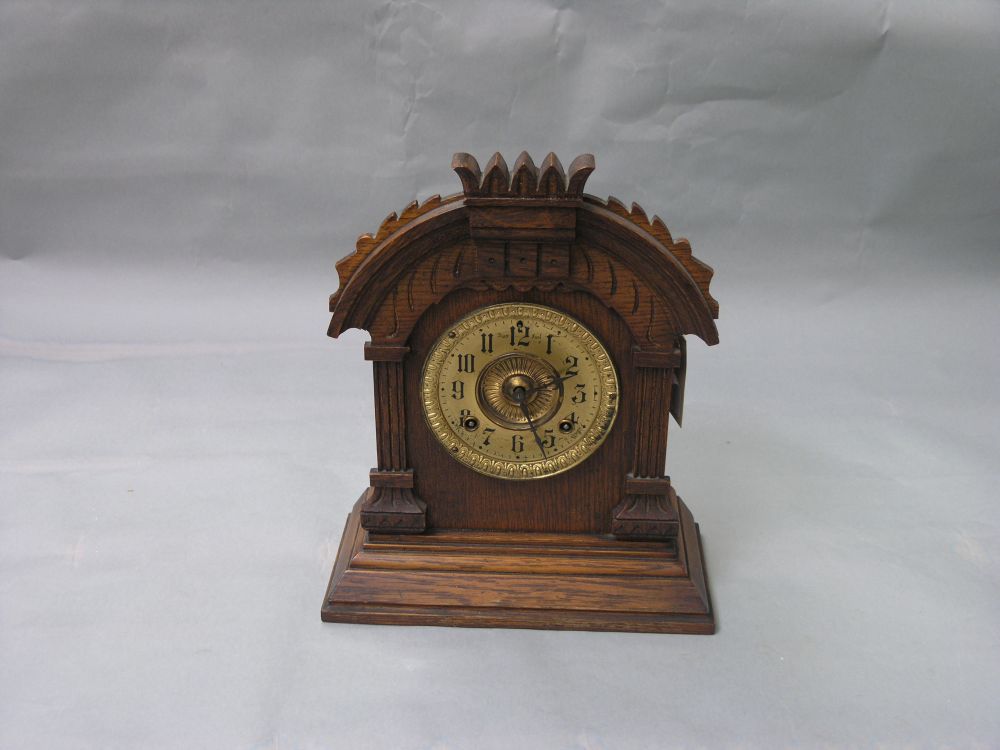 Appraisal: An Ansonia mantel clock with brass dial and eight day