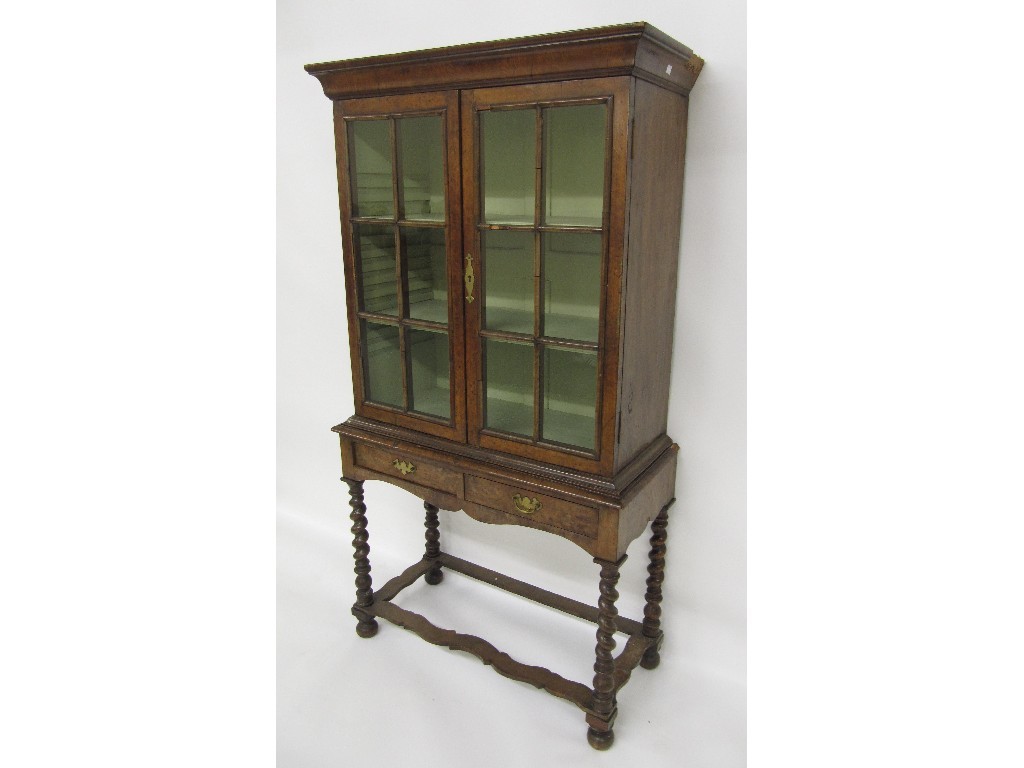 Appraisal: A George III walnut bookcase on a lowboy base the