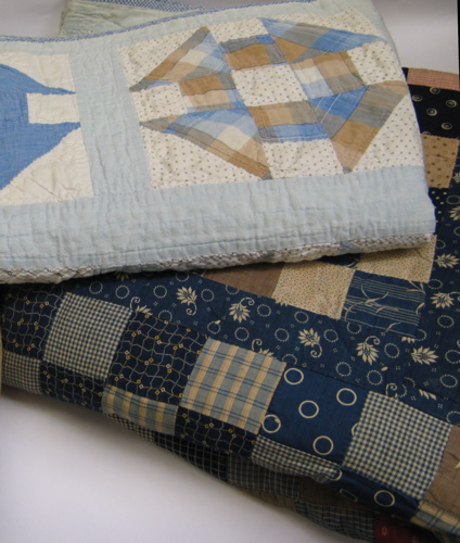 Appraisal: TWO AMERICAN PIECED PATCHWORK QUILTS One in a multi-colored block