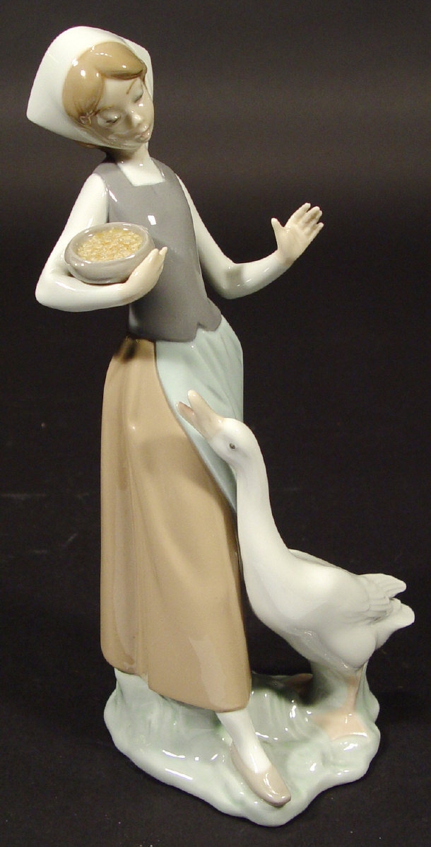 Appraisal: Lladro porcelain girl with a goose with hand painted decoration