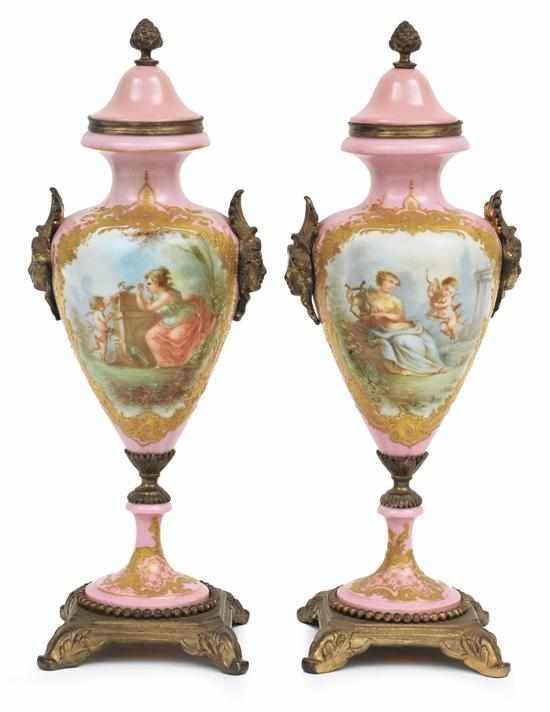 Appraisal: A pair of Sevres style porcelain lidded urns Signed Boulee