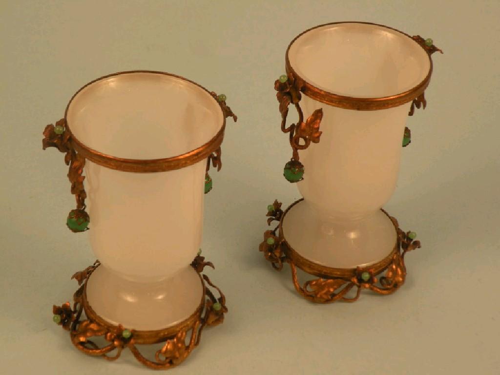 Appraisal: A pair of thC opaque glass urns each with gilt