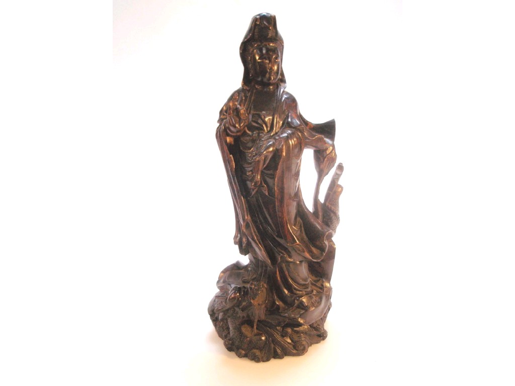 Appraisal: A Chinese hardwood figure carved as a Lohan with flowing