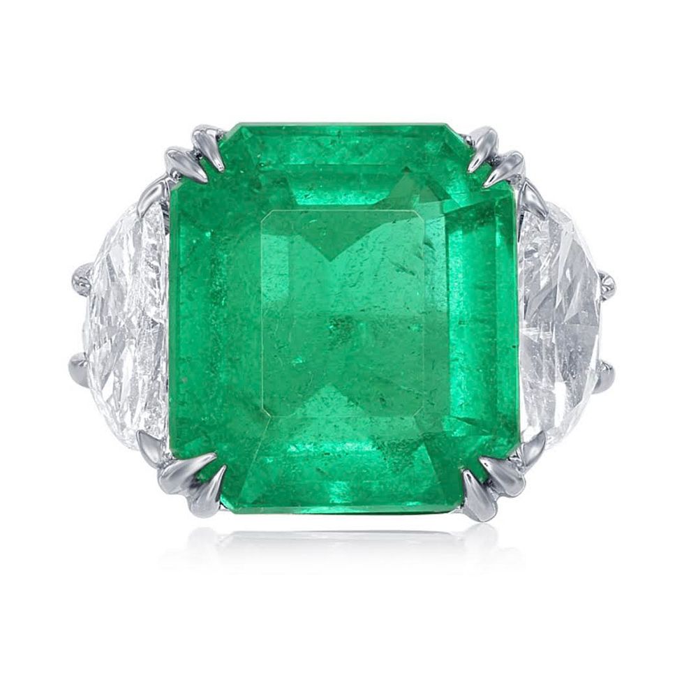 Appraisal: COLOMBIAN EMERALD AND DIAMOND RING COLOMBIAN EMERALD AND DIAMOND RINGA