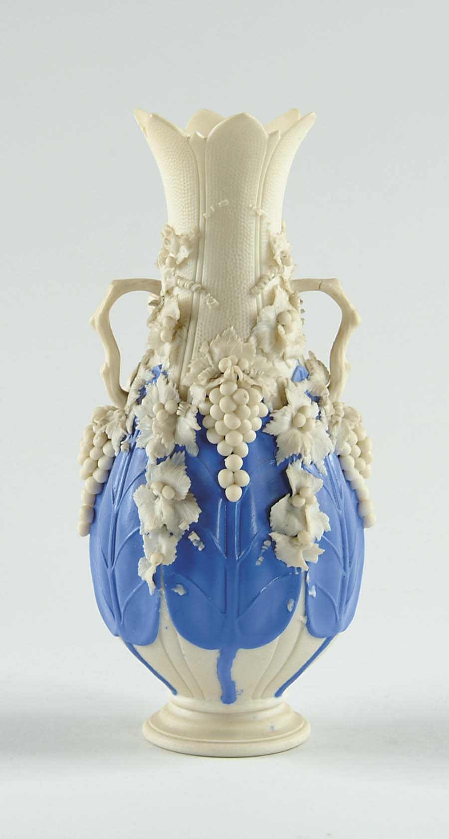 Appraisal: GRAPE DECORATED PARIAN VASE Leaf paneled vase has six blue