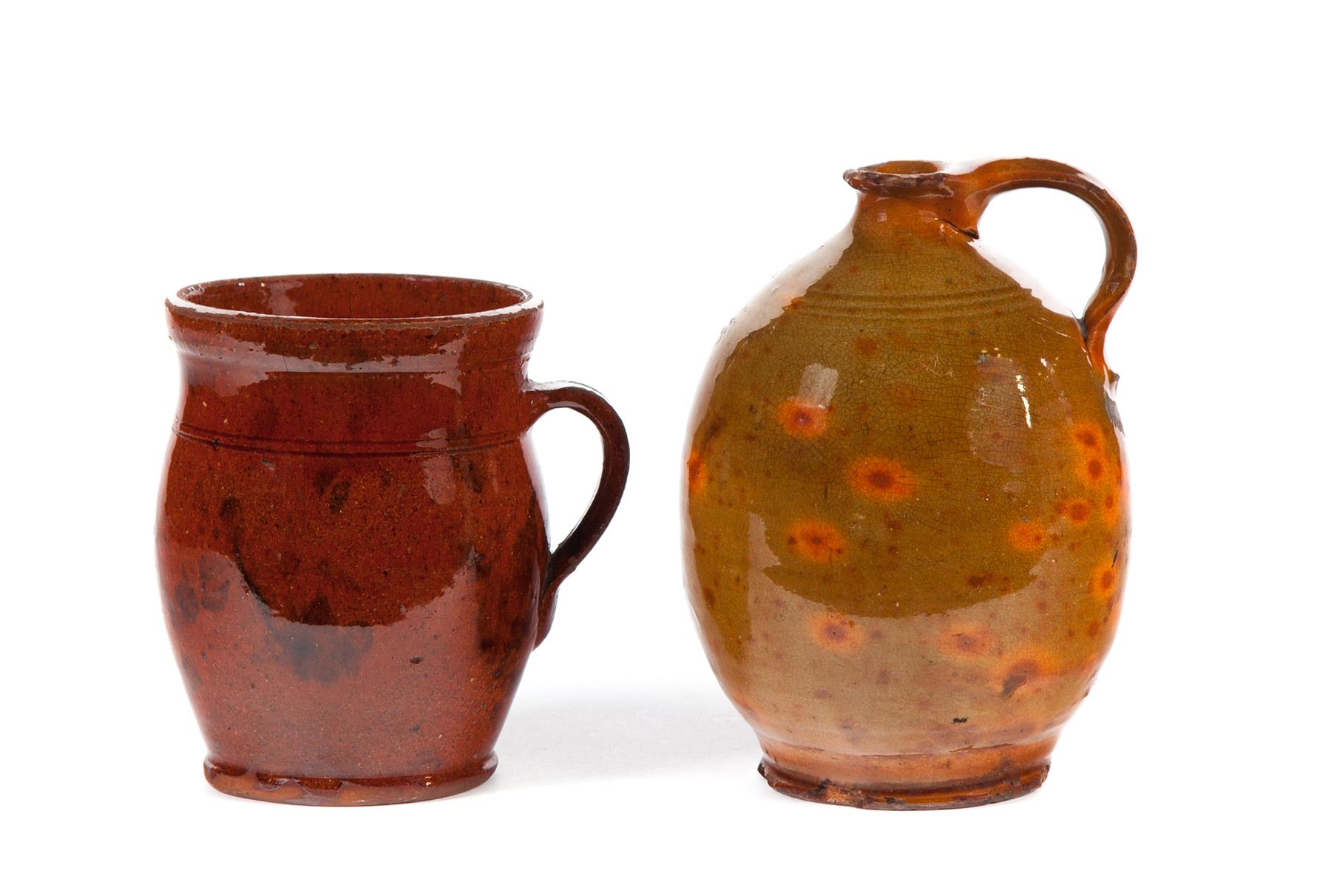 Appraisal: TWO AMERICAN REDWARE PIECES Mid th century Jug with strap