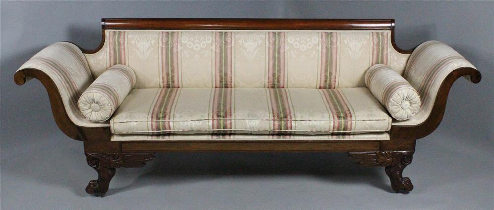 Appraisal: CLASSICAL CARVED ROSEWOOD SOFA with a straight molded crest rail