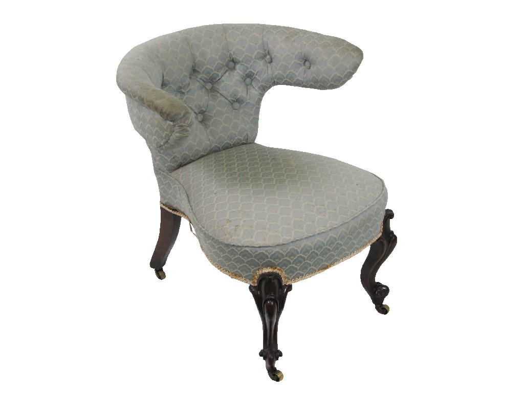 Appraisal: A Victorian buttonback upholstered armchair on mahogany scroll carved legs