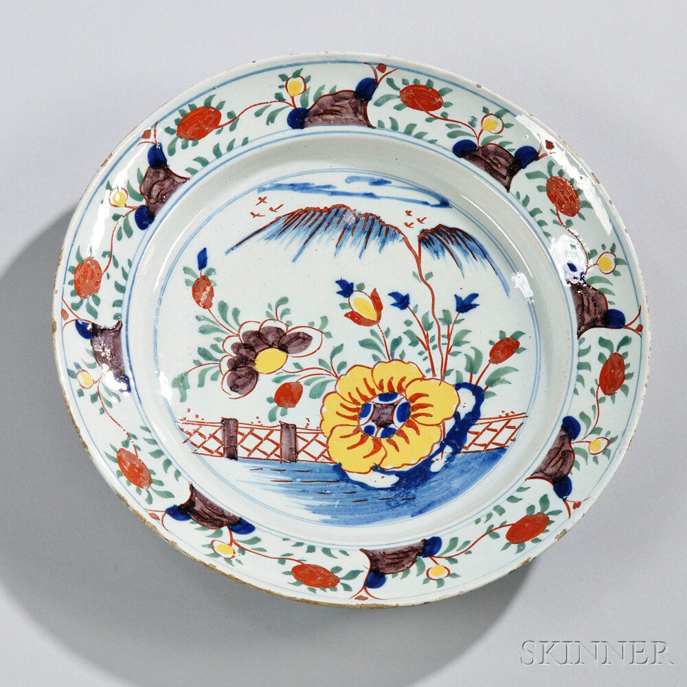 Appraisal: Dutch Delftware Polychrome Decorated Charger Holland mid- th century fruit