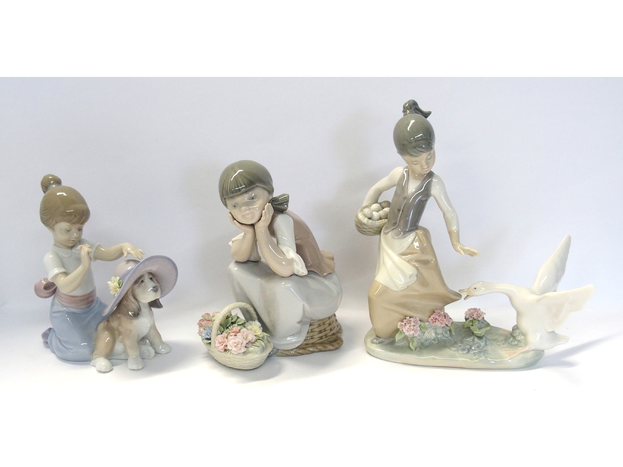 Appraisal: Three Lladro figures including An Elegant Touch modelled by Jos