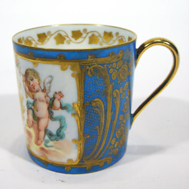 Appraisal: Sevres porcelain cofffee can hand painted and gilded with cherubs