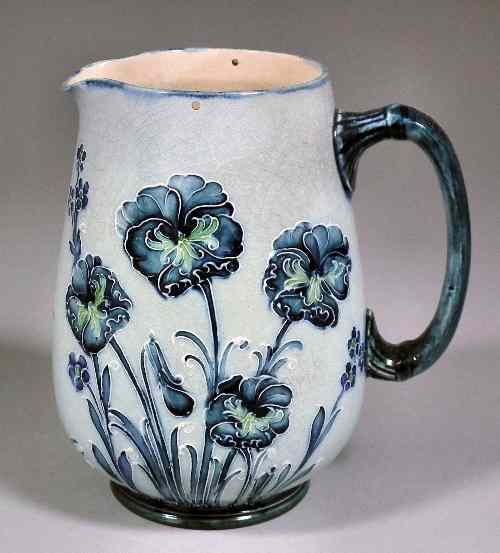 Appraisal: A James MacIntyre Co pottery hot water jug designed by