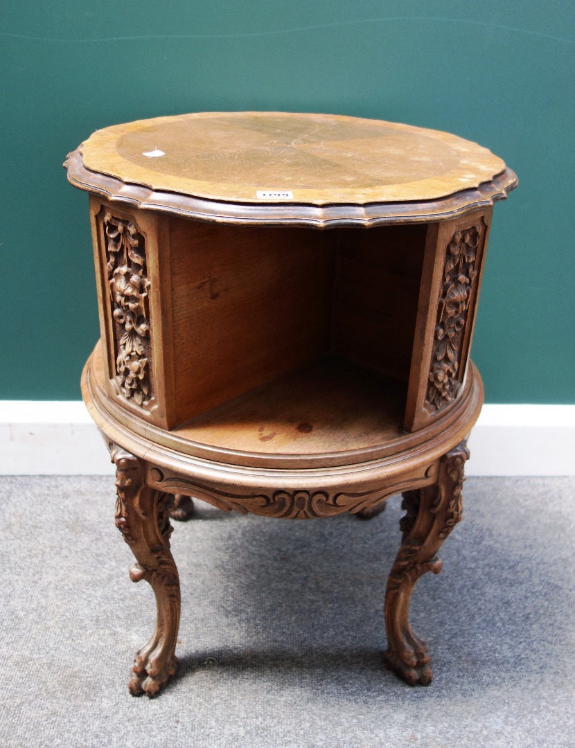 Appraisal: An early th century carved walnut circular revolving book stand