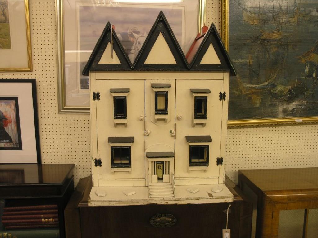 Appraisal: A painted wood doll's house finished in cream with triple