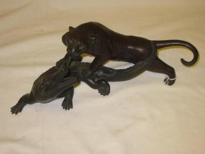 Appraisal: A JAPANESE BRONZE GROUP of a tiger attacking a crocodile