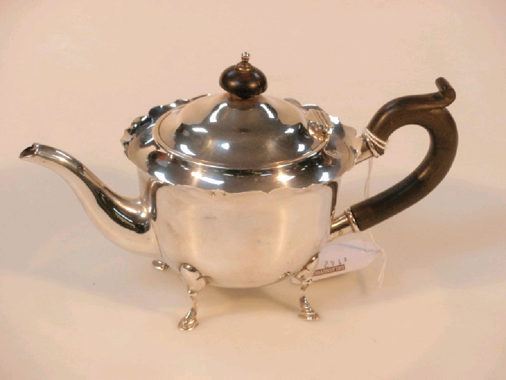 Appraisal: A Victorian silver bachelors circular teapot Birmingham with a cut