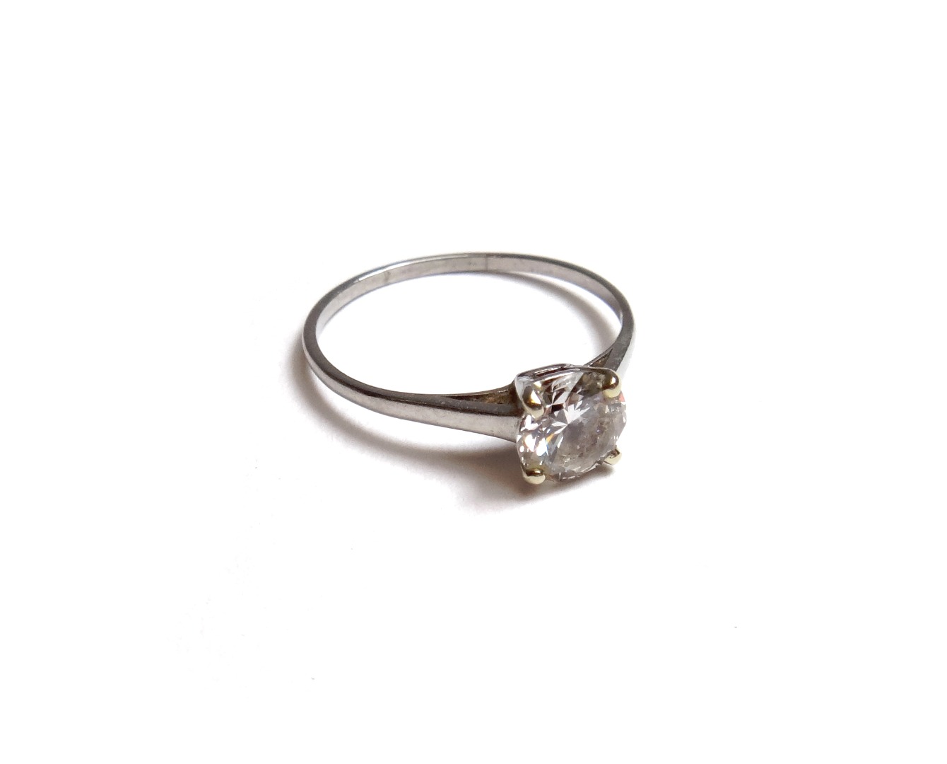 Appraisal: A diamond set single stone ring claw set with a