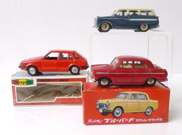 Appraisal: THREE JAPANESE DIECAST MODELS INCLUDING MODEL PET DATSUN BLUEBIRD FANCY