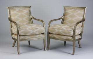 Appraisal: Contemporary upholstered chairs Pair of contemporary armchairs upholstered in tan