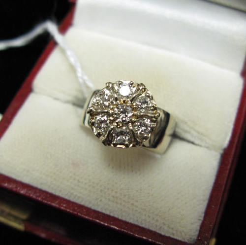 Appraisal: DIAMOND AND FOURTEEN KARAT WHITE GOLD CLUSTER RING set with