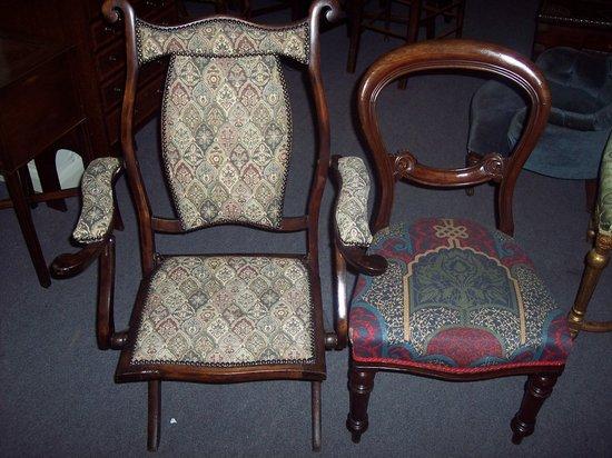 Appraisal: A Victorian folding chair with upholstered seat back and arms