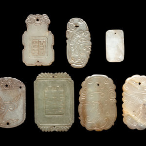 Appraisal: Seven Chinese Celadon Jade Carved Plaques each stone with russet