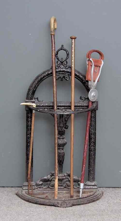 Appraisal: A Victorian ebonised cast iron bow fronted stick stand ins