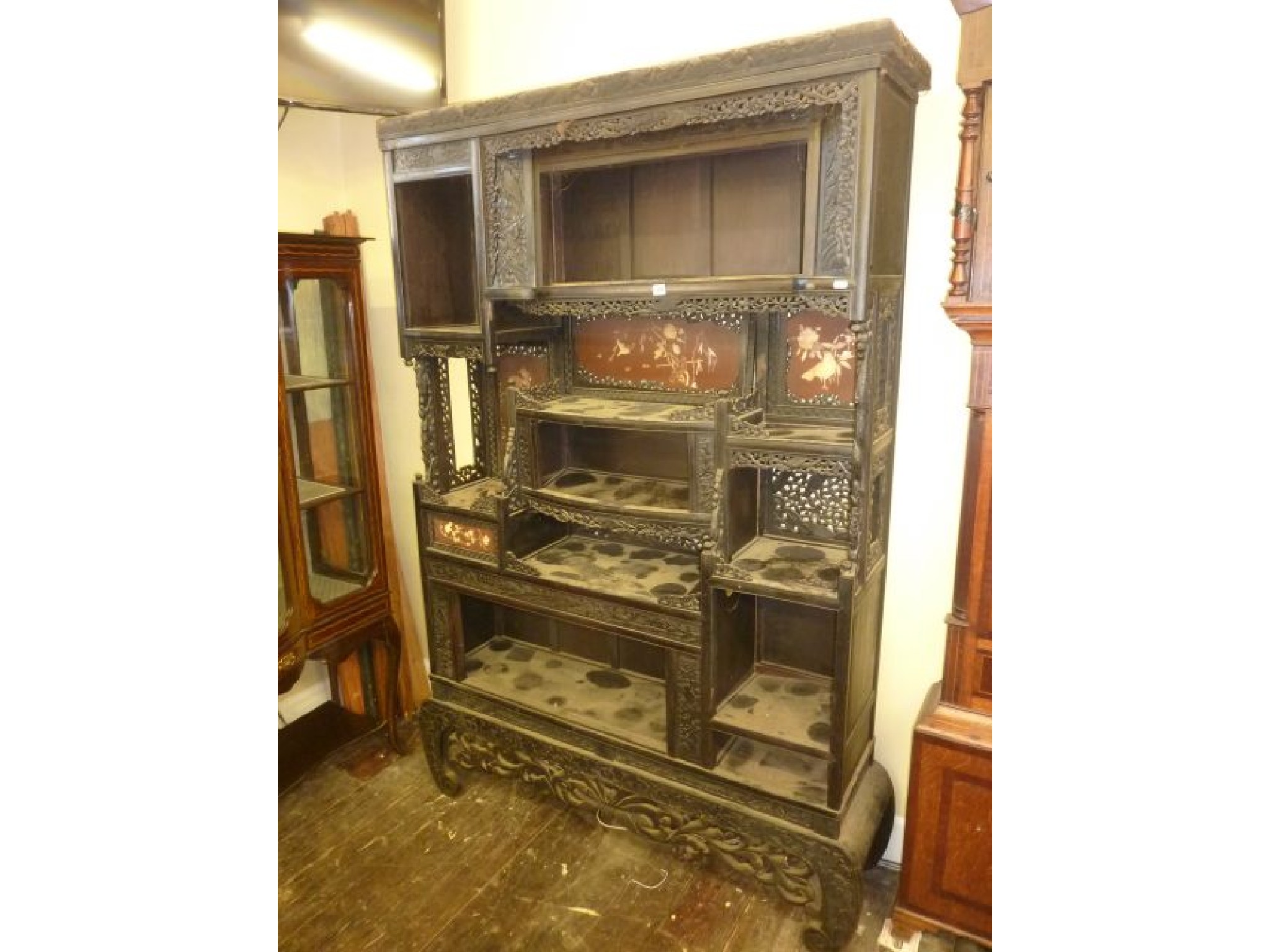 Appraisal: A th century Japanese cabinet the ebonised frame with red