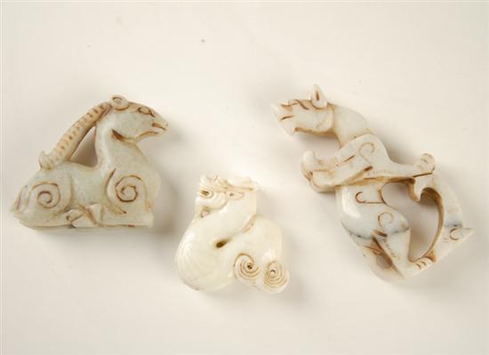 Appraisal: A Grouping of Carved Chinese Jade Figures possibly Han Dynasty