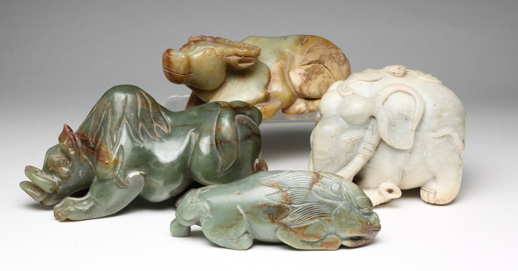 Appraisal: FOUR ASIAN STONE CARVED ANIMALS Second half th century Water