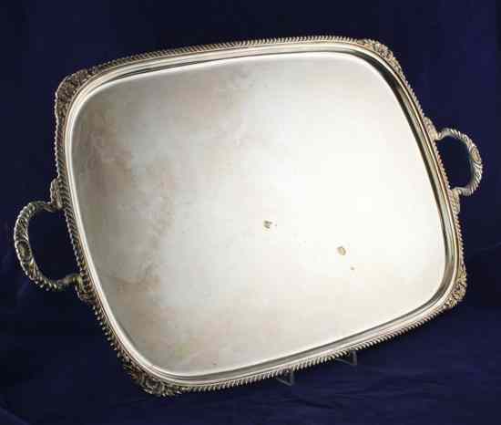 Appraisal: A modern silver two handled tea tray of shaped rectangular