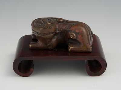 Appraisal: A Miniature Bronze Dog Scroll Weight Age unknown appears to