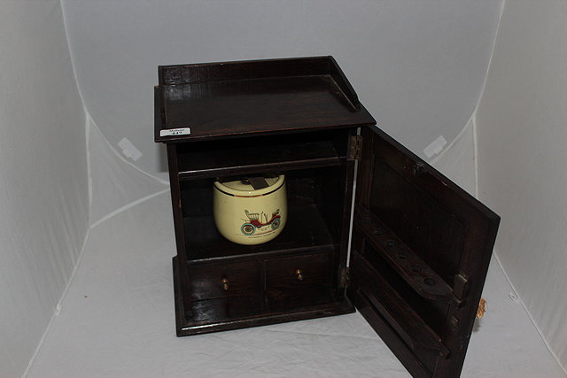 Appraisal: A 'S OAK SMOKER'S CABINET with a porcelain mixing bowl