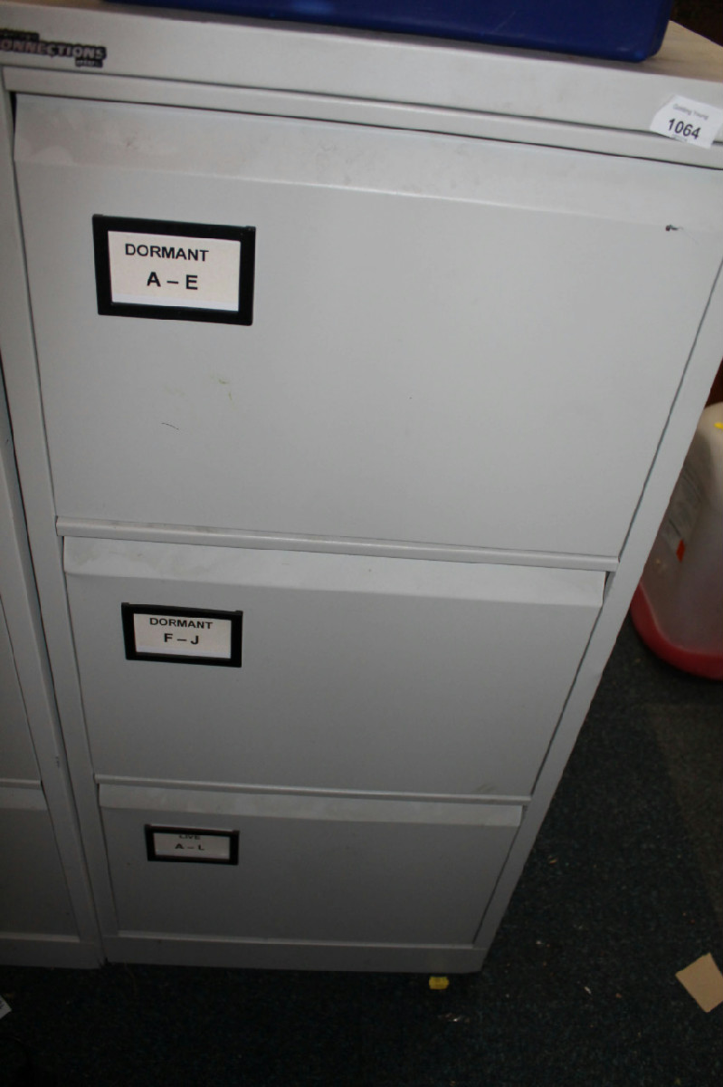 Appraisal: A grey metal three drawer filing cabinet