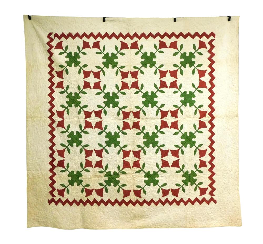 Appraisal: TEXTILES Quilt with red and green applique stylized flower with