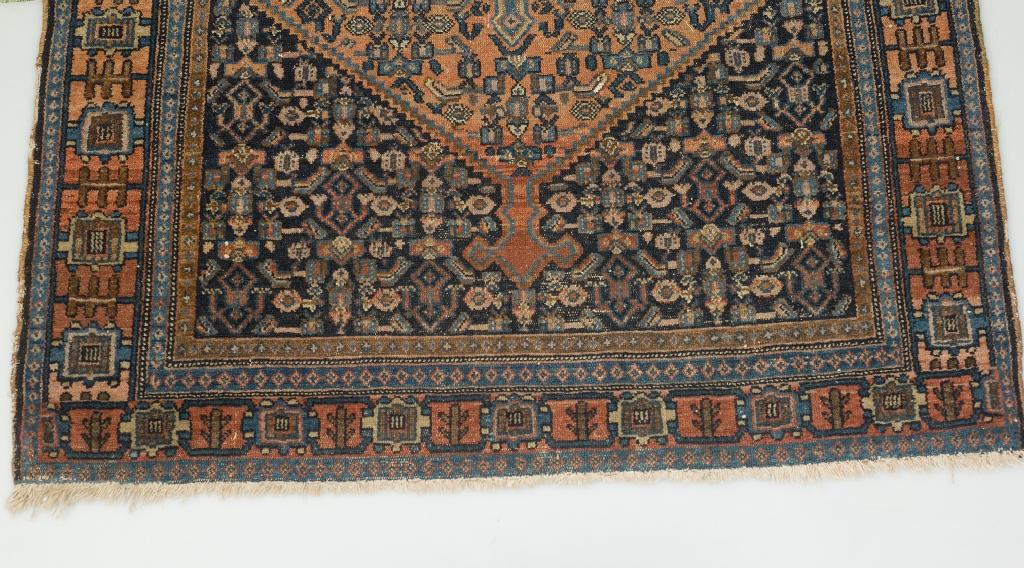 Appraisal: FERRAHAN RUG c with terracotta and dark blue central field