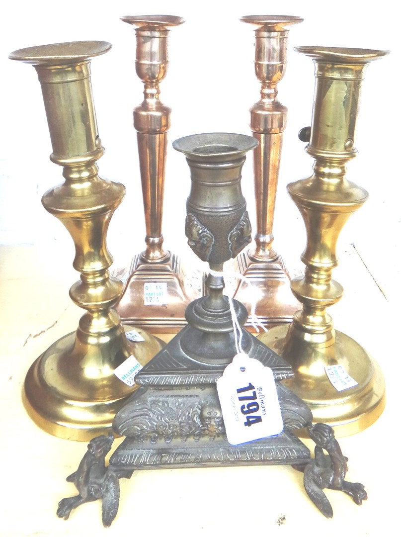 Appraisal: A pair of Georgian brass ejector candlesticks on square bases