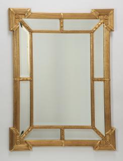 Appraisal: Carved gilt wood beveled mirror h Hollywood Regency style carved