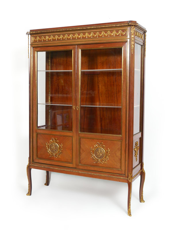 Appraisal: FRENCH STYLE ORMOLU DISPLAY CABINET th century production mahogany veneer