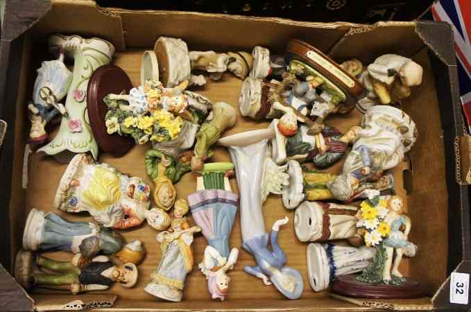 Appraisal: A collection of various pottery figures bisque style and resin