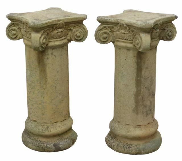 Appraisal: pair Cast stone garden statuary having shaped top over Composite