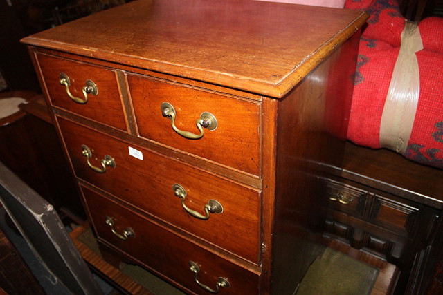 Appraisal: A SMALL VICTORIAN MAHOGANY CHEST of two long two short