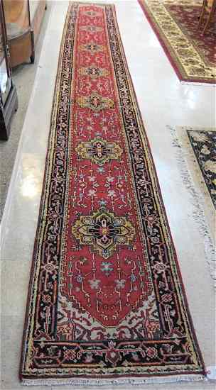 Appraisal: HAND KNOTTED ORIENTAL CORRIDOR RUG Persian Serapi design featuring seven