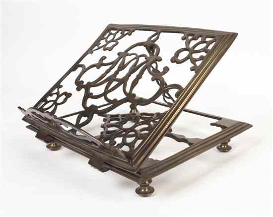 Appraisal: A Continental Brass Book Stand of square form having openwork