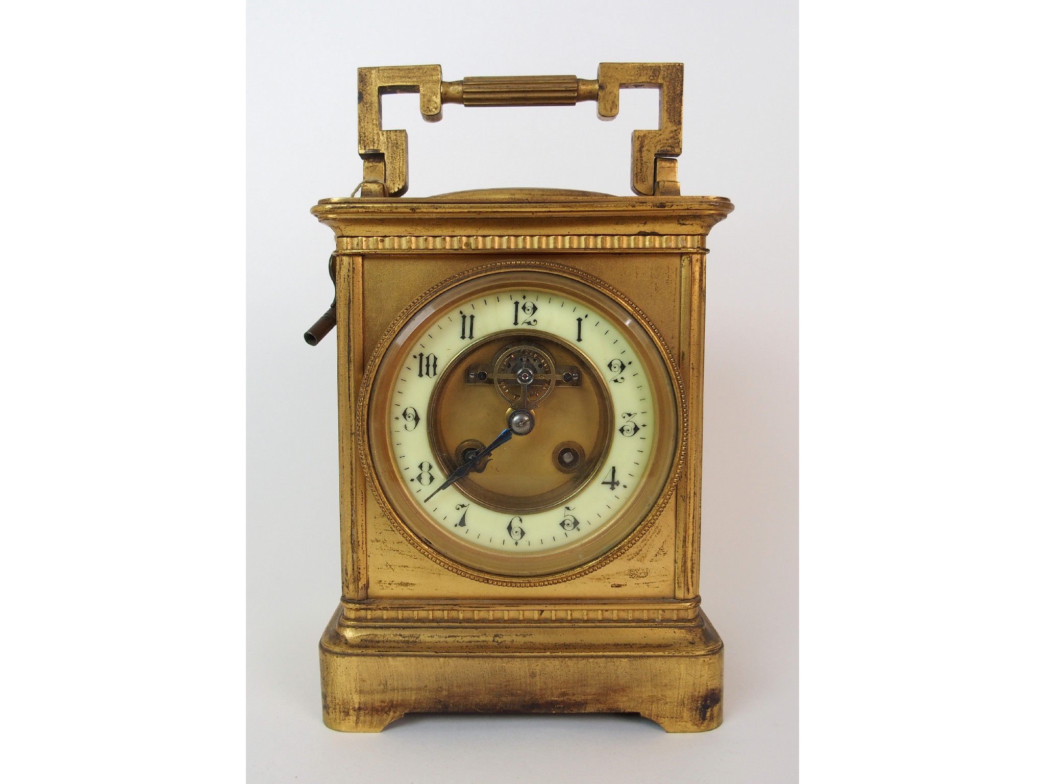 Appraisal: A French gilt metal and glass carriage clock with integrated