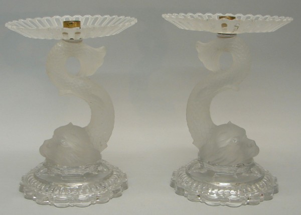 Appraisal: Pair of candlesticks in form of dolphins clear glass base