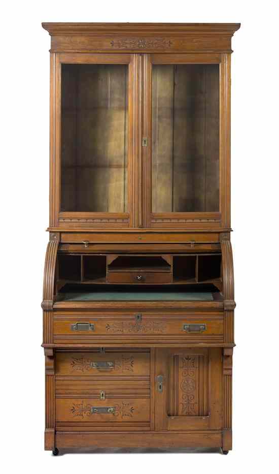 Appraisal: An Eastlake Burlwood Roll Top Secretary Bookcase in two parts