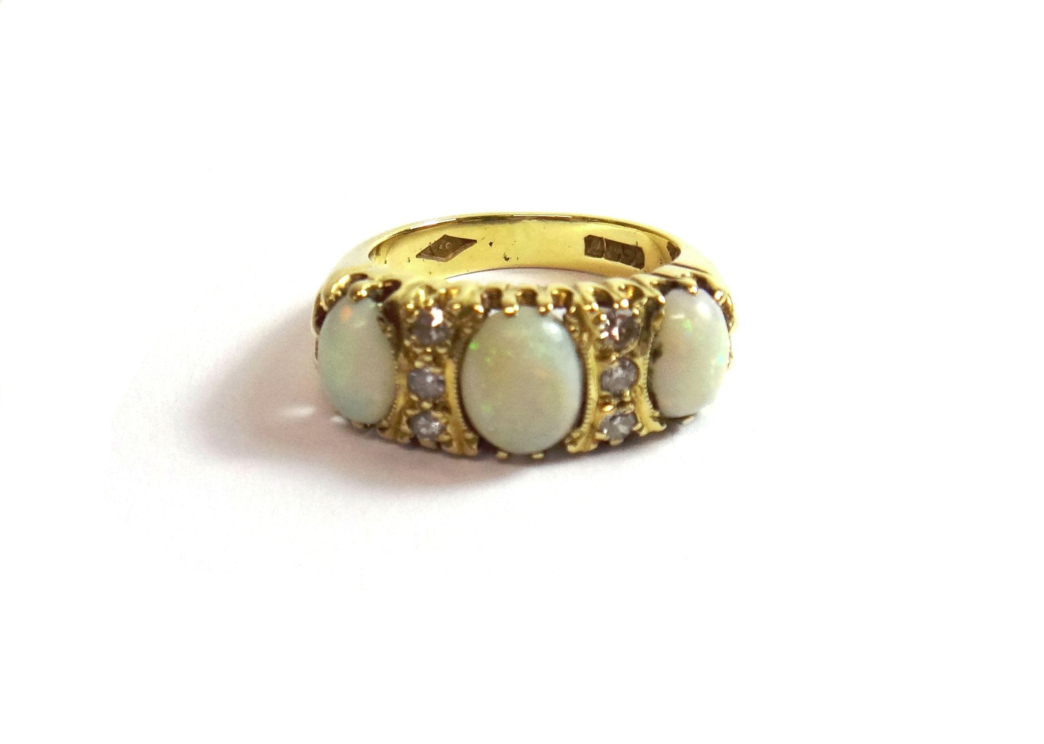 Appraisal: An ct gold opal and diamond set ring mounted with