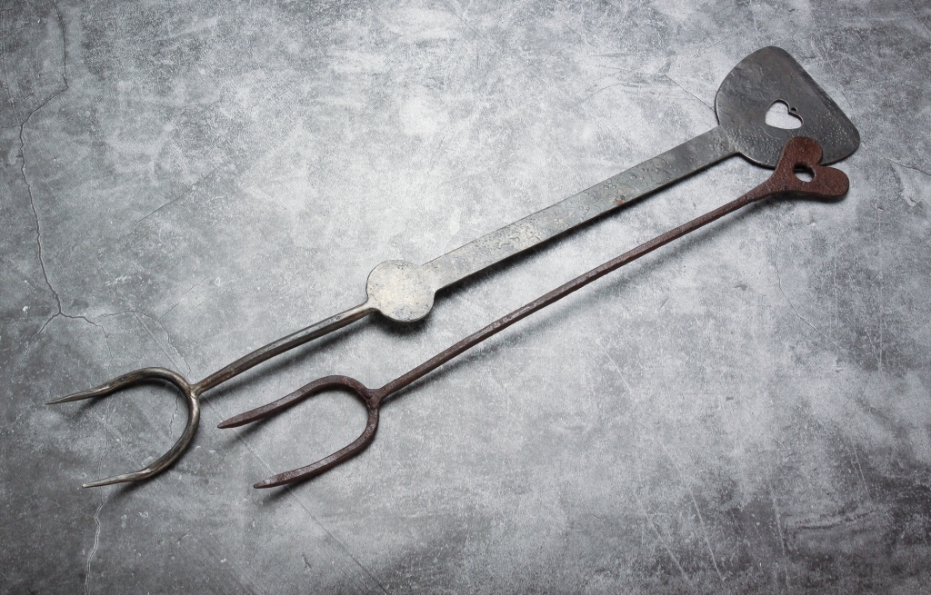 Appraisal: TWO AMERICAN IRON FORKS Nineteenth century wrought iron fork with